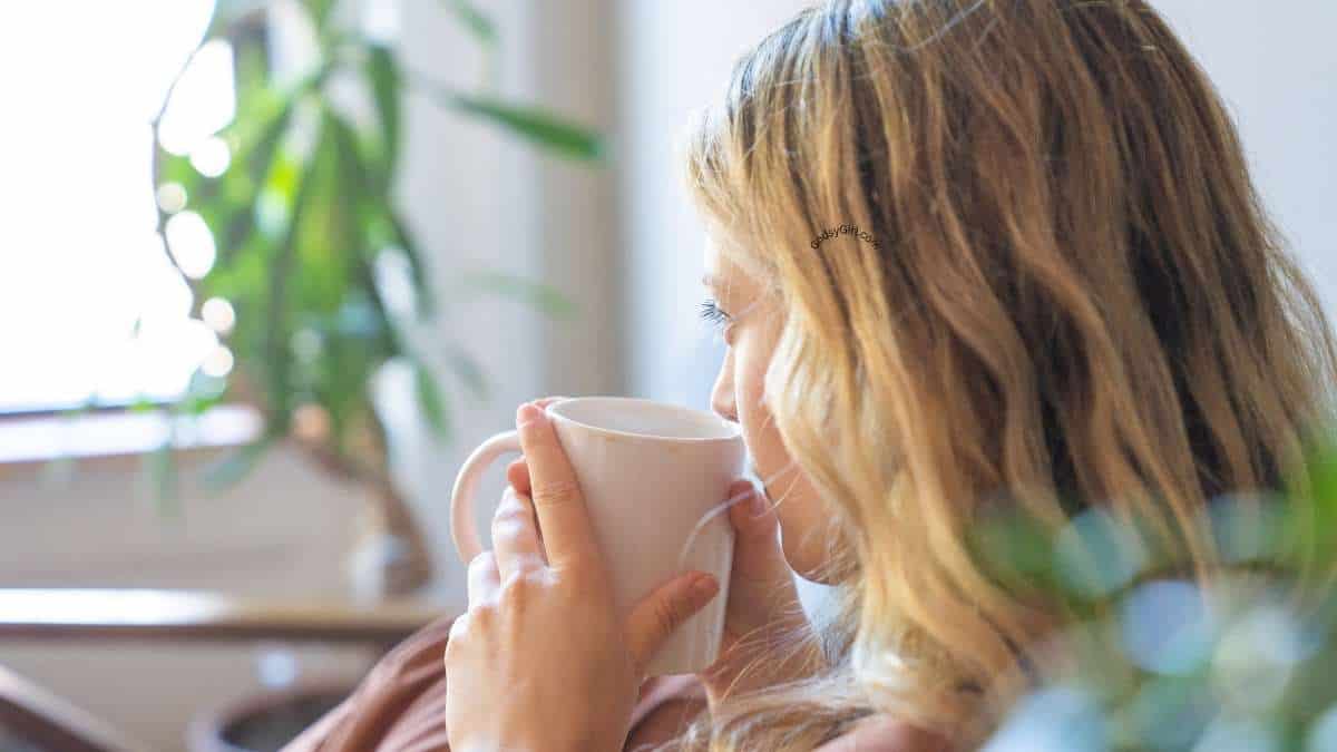 a woman drinking from a mug at peace from How to Be Healed in the Name of Jesus